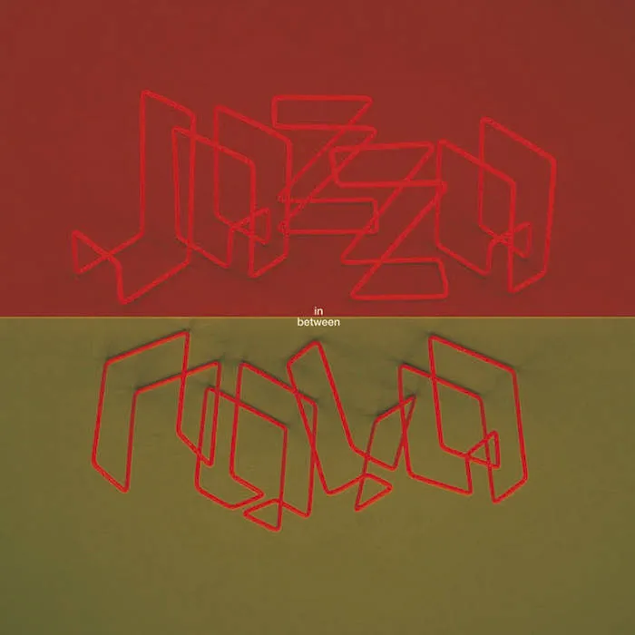 Jazzanova InBetween  Album cover. Red on the top half with  the works 'jazza', gold on the bottom half with the words 'nova'