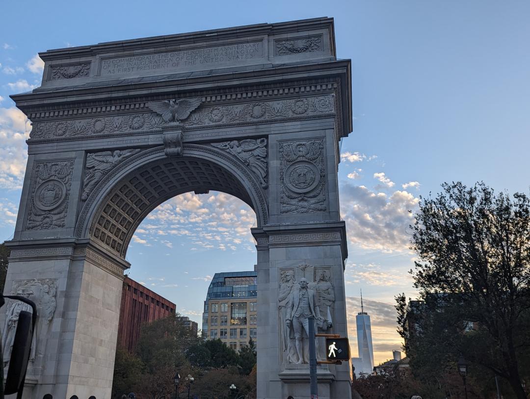 The arch in Washington Square Park NYC with the Freedom Tower in the background