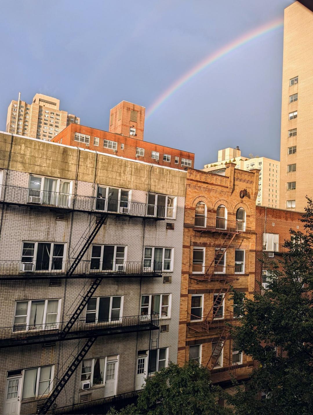 A rainbow over NYC apartment buildings.