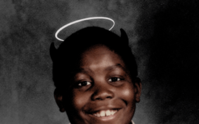 The album cover of Michael, a young picture of killermike with both devil horns and an angel halo